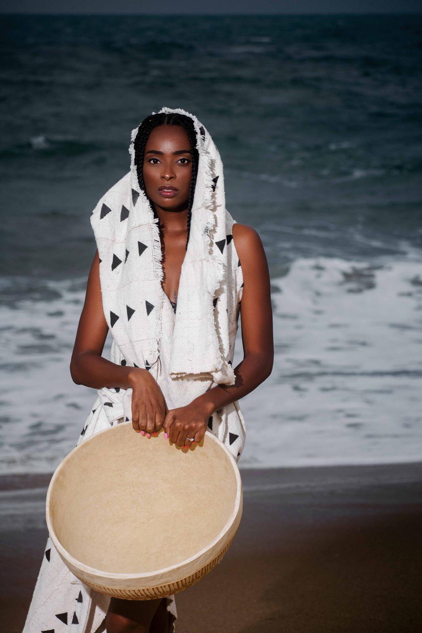 Bogolan artisan wrap dress with sculptural drape — mud-cloth womenswear — SAAHEL