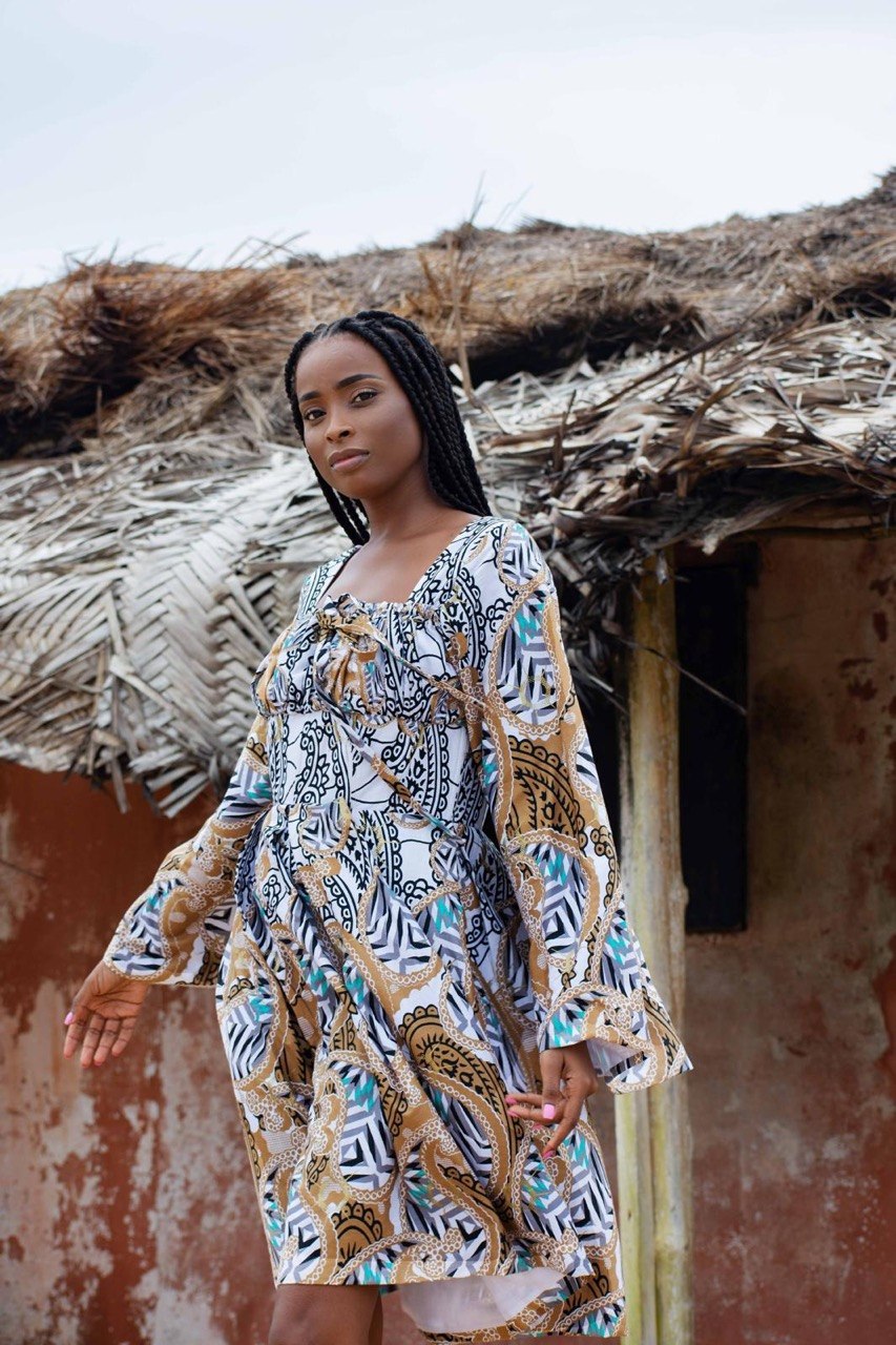 Feminine Woodin mini dress detail view — vibrant African print — SAAHEL